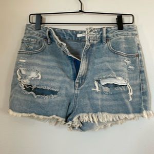 Packing distressed Jean shorts.
